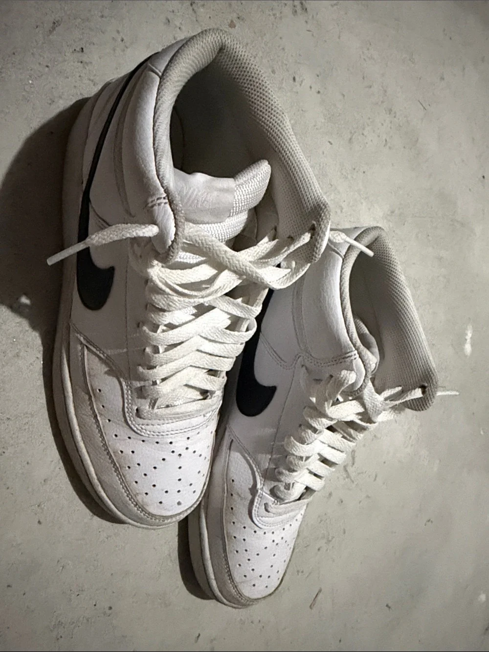 Nike White High-Top Sneakers with Black Swoosh